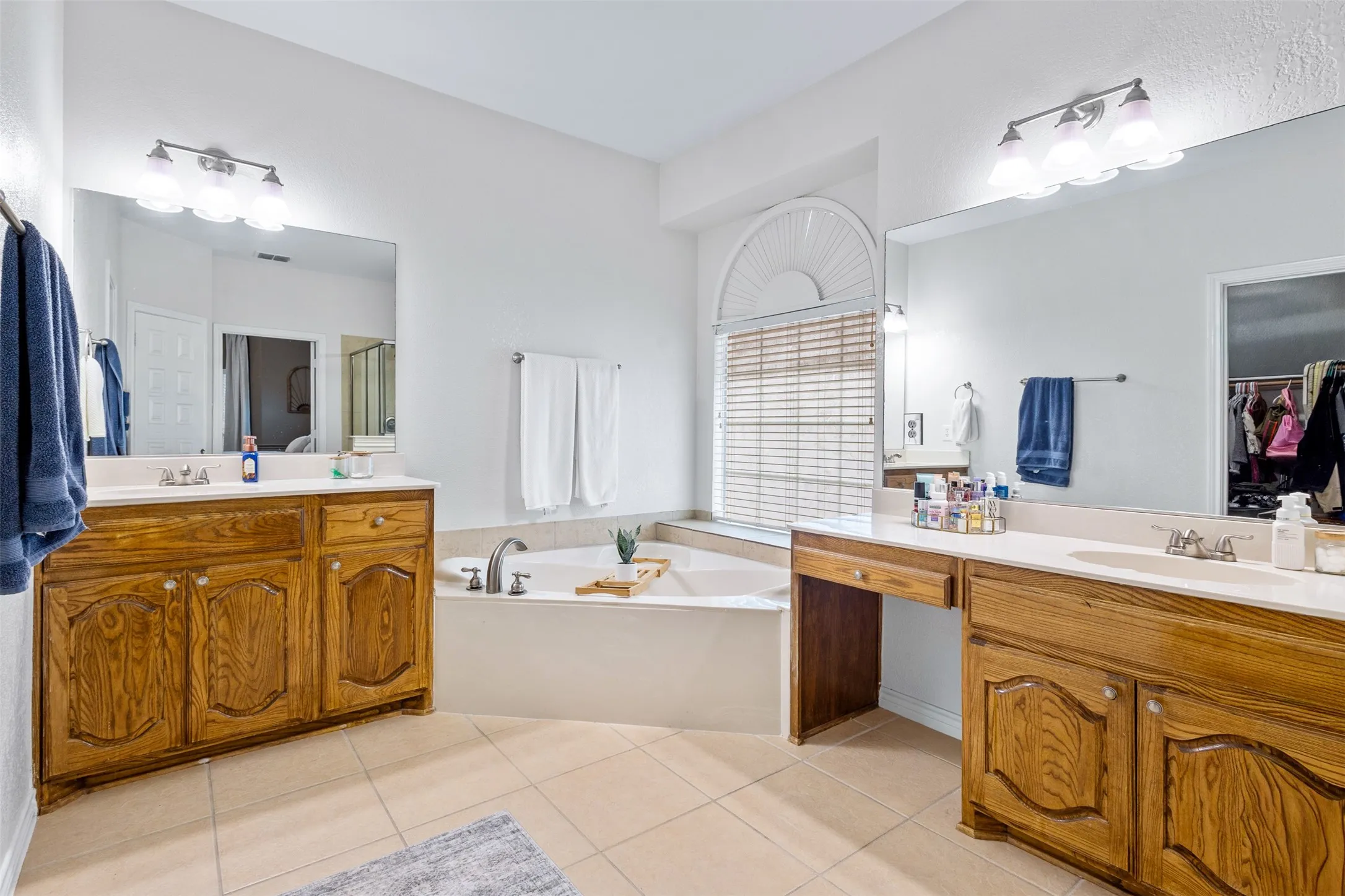 Dual vanity sinks with wood​​‌​​​​‌​​‌‌​‌‌​​​‌‌​‌​‌​‌​​​‌​​ cabinetry