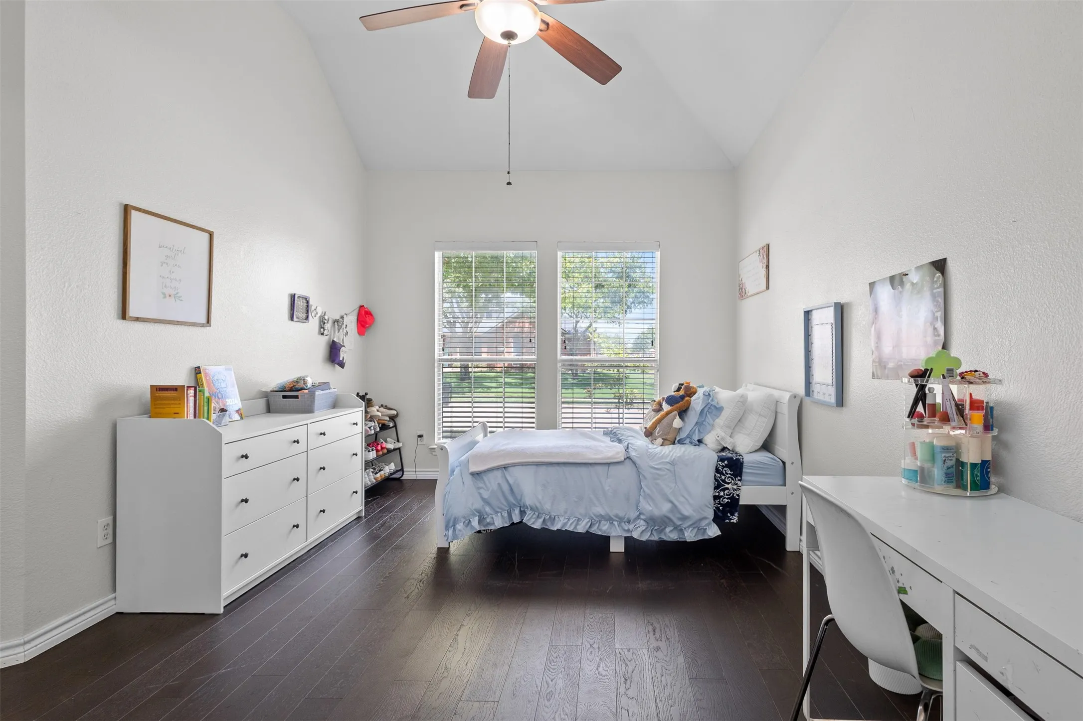 Vaulted ceiling, ceiling fan, wood-finish flooring, dual windows, interior blinds