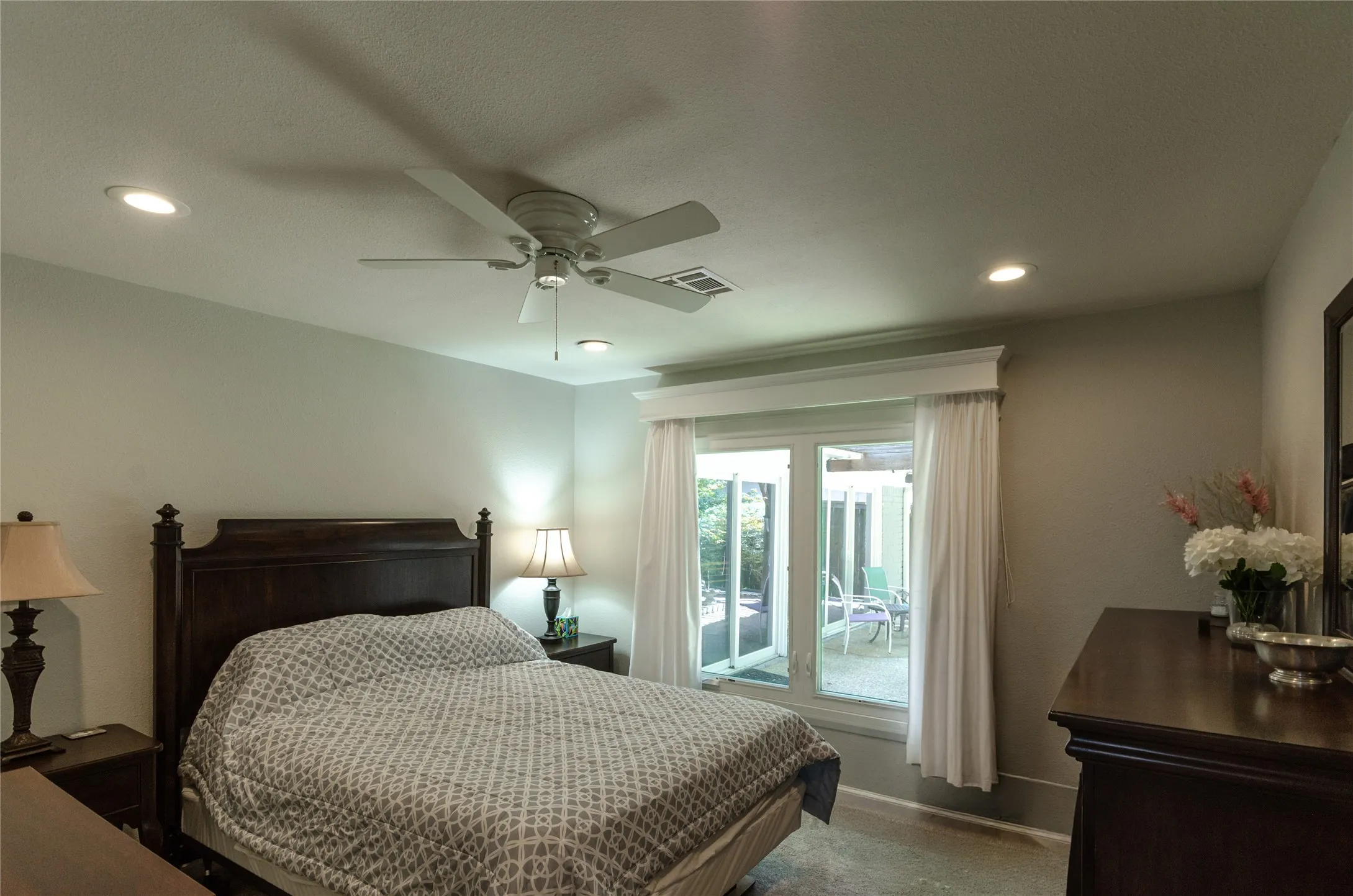 Bedroom # 2 with recessed lighting, ceiling fan, and sliding glass door to outdoor space