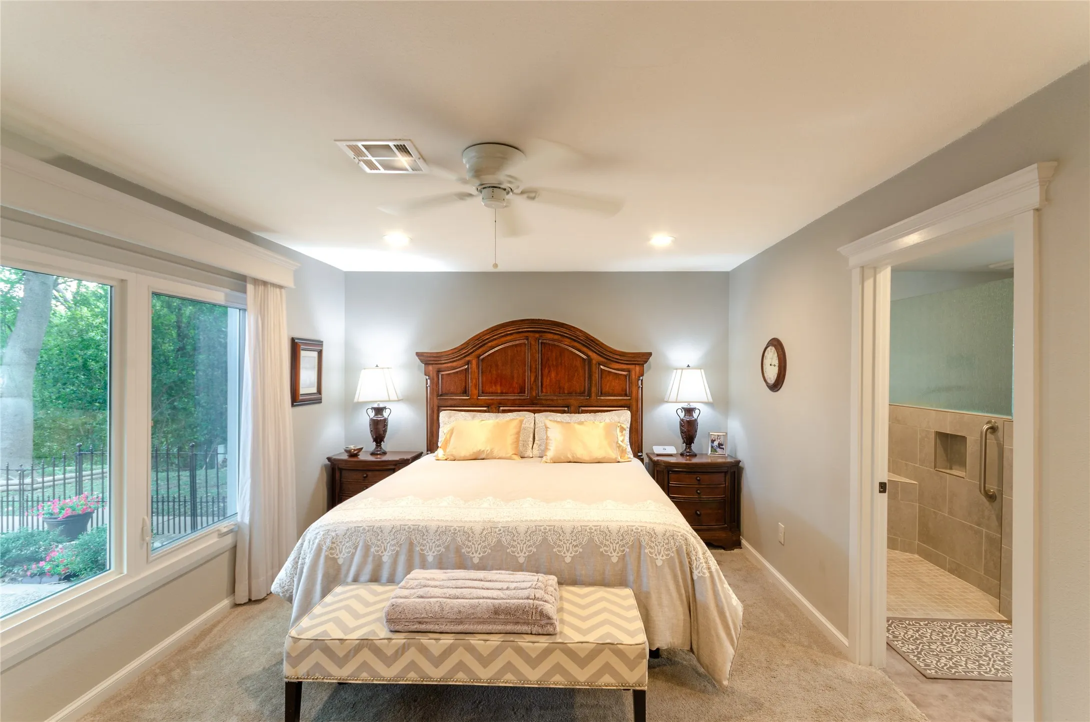 Wall-to-wall carpeting with light gray paint, recessed lighting, and a ceiling fan