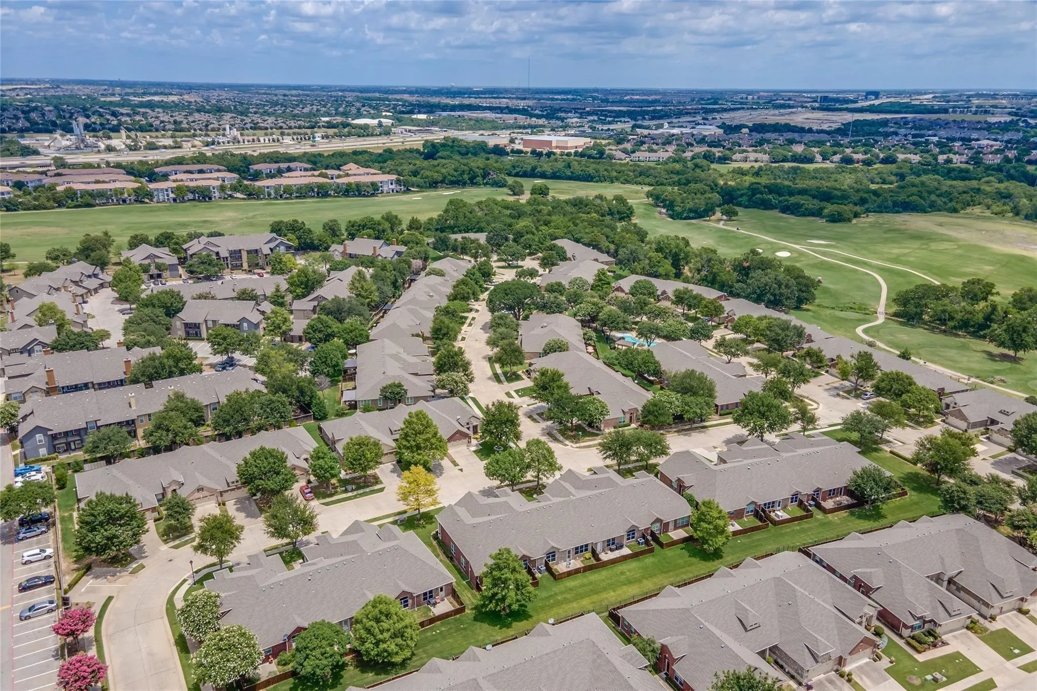 Community with mature trees and golf course proximity