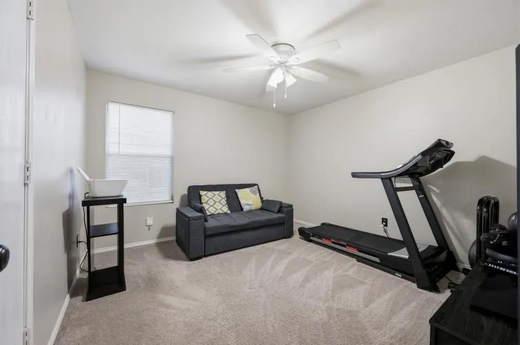One of the bedrooms is being used for exercise
