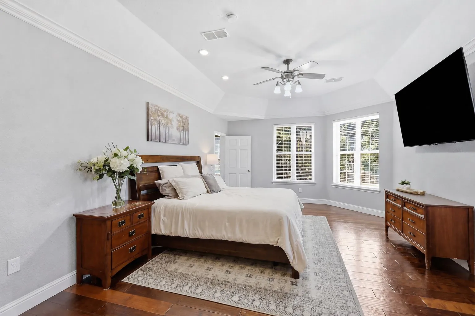 Spacious primary has ample light and tall ceilings