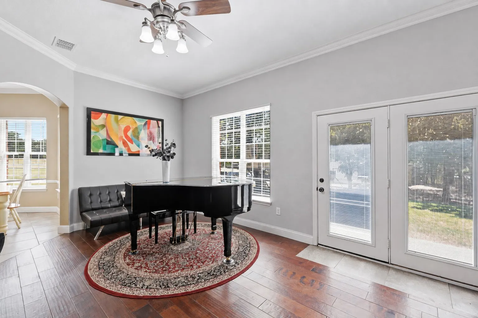 An extra sitting room for lounging or playing your baby grand (Taxidermy removed using AI)