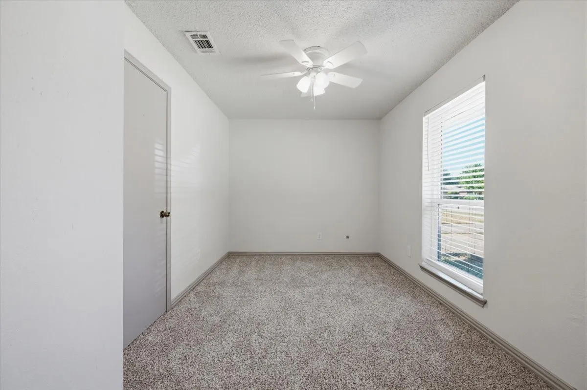 Bedroom 3 with view of the front yard