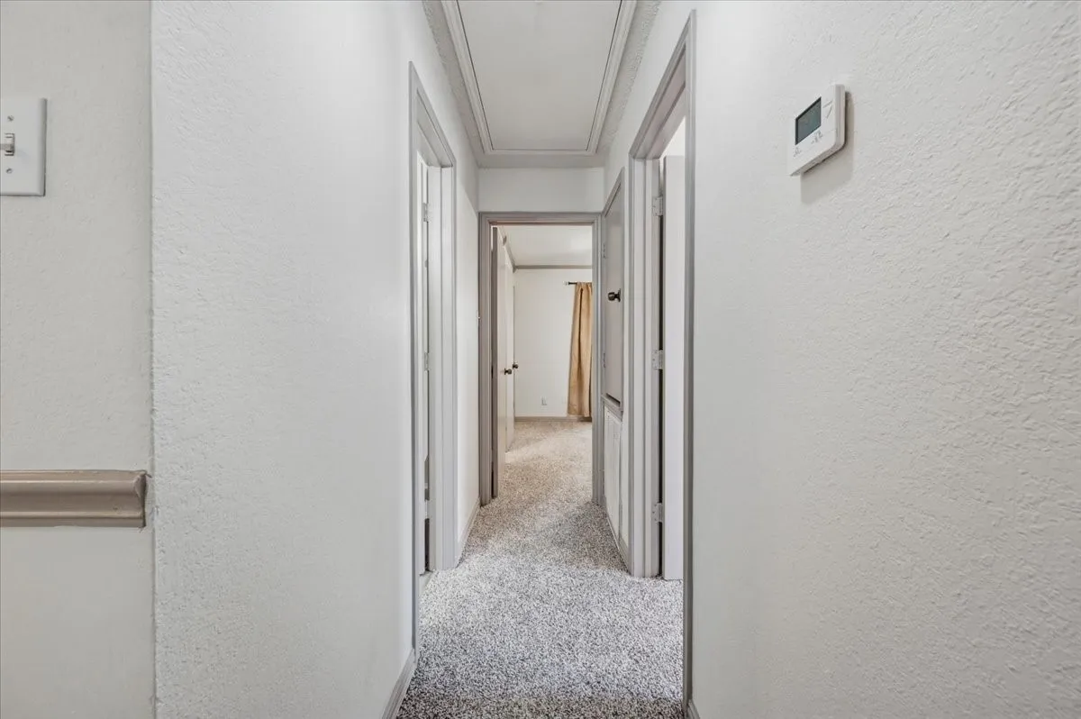 Hallway to bedrooms and bathrooms