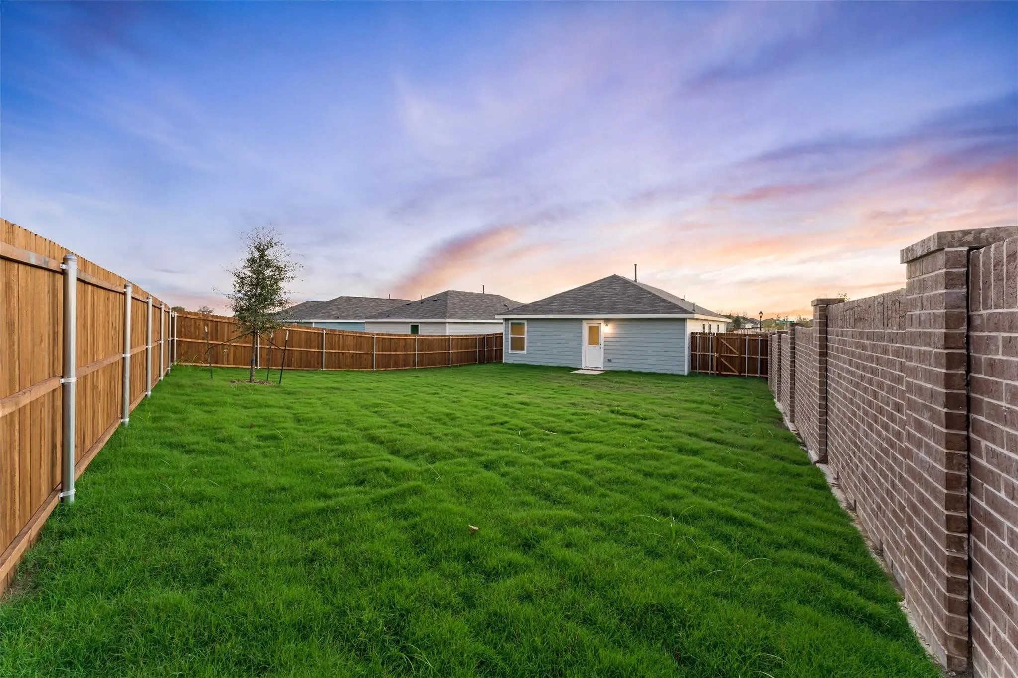 View of fenced backyard