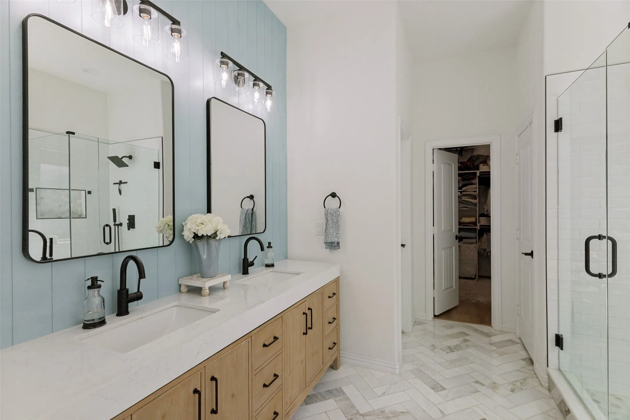 Dual vanity with integrated sinks and wood-finish cabinetry