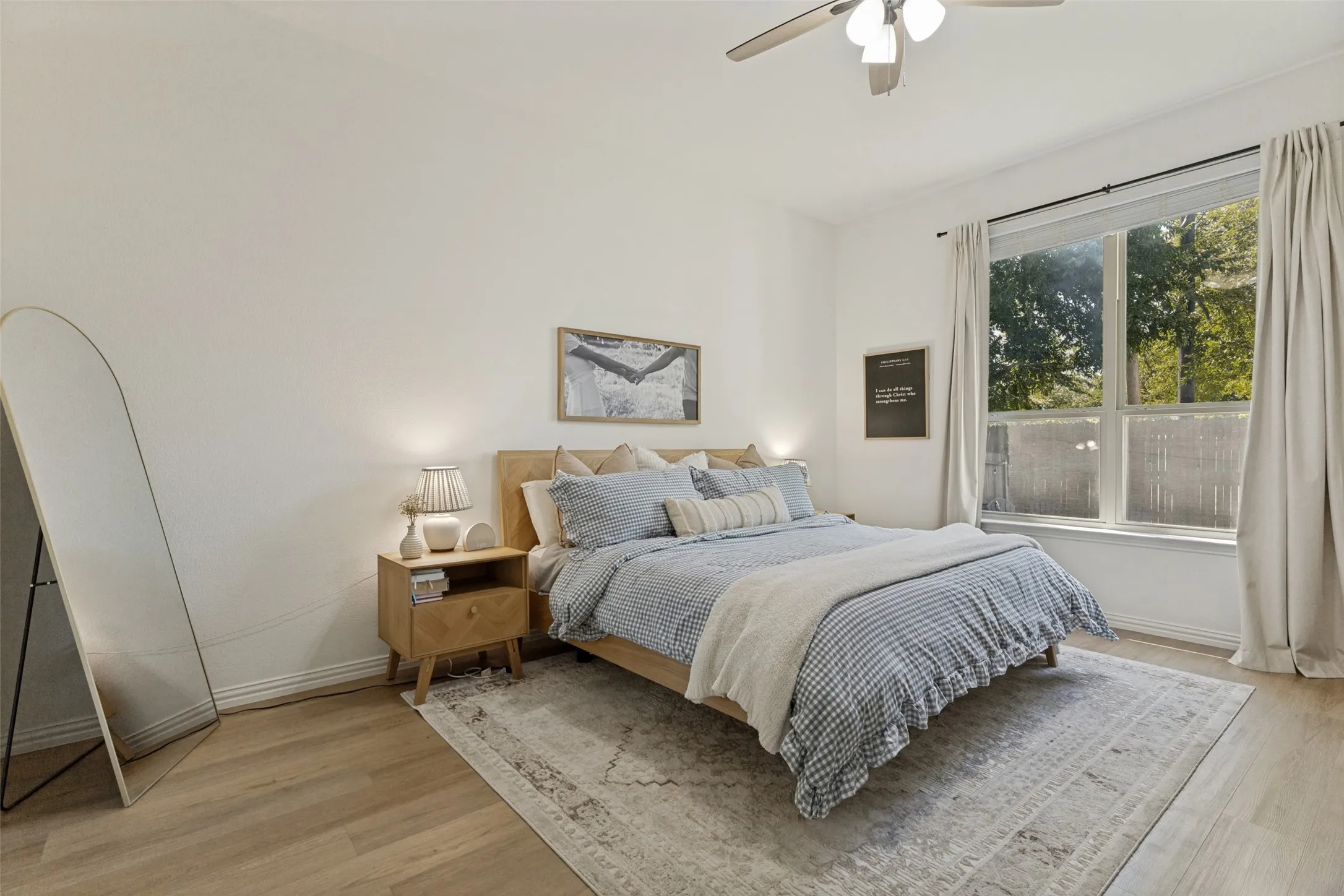 Hardwood-finish flooring, recessed lighting, and a ceiling fan with integrated lighting