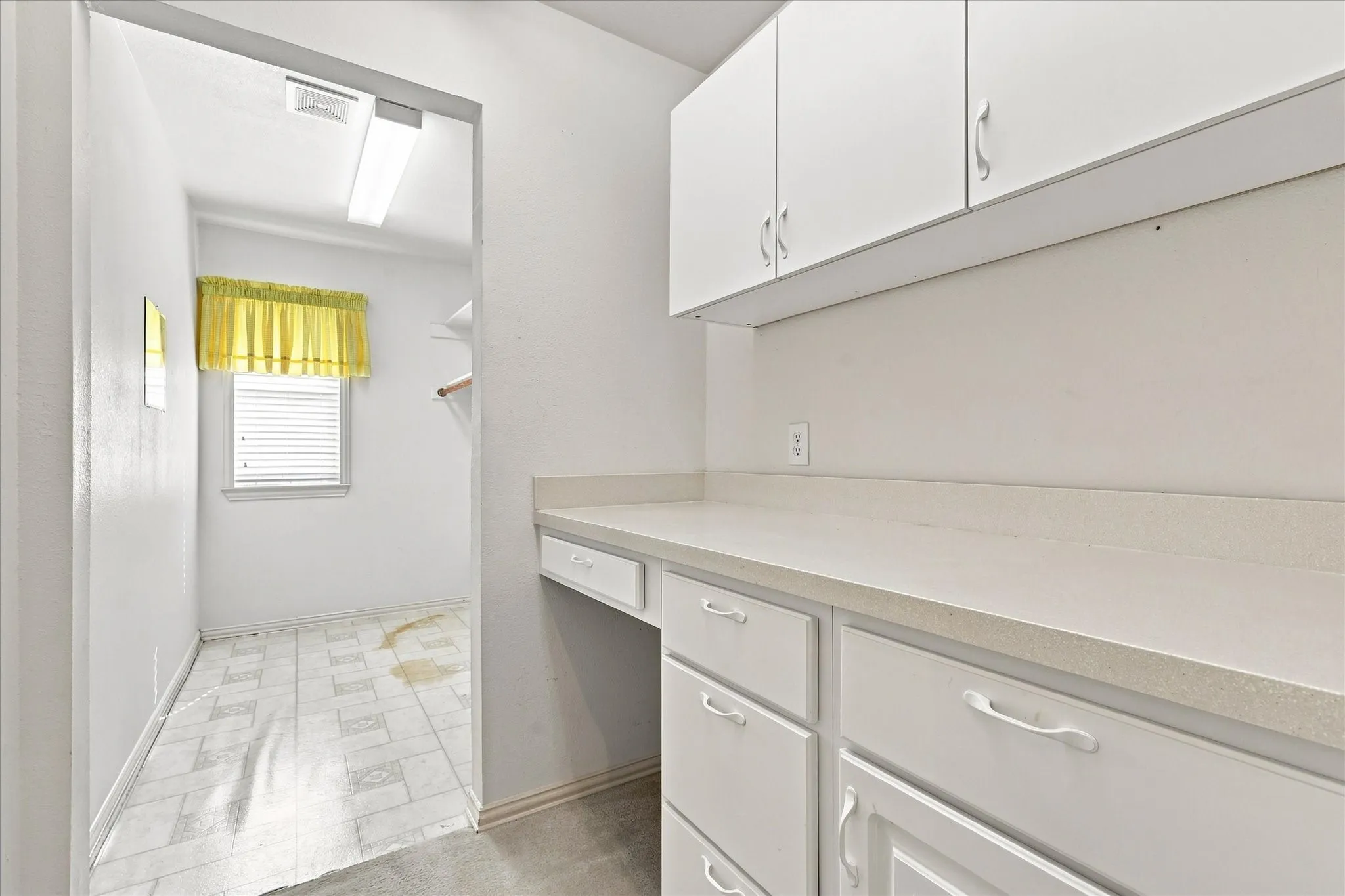 Storage area and counter space off the utility room