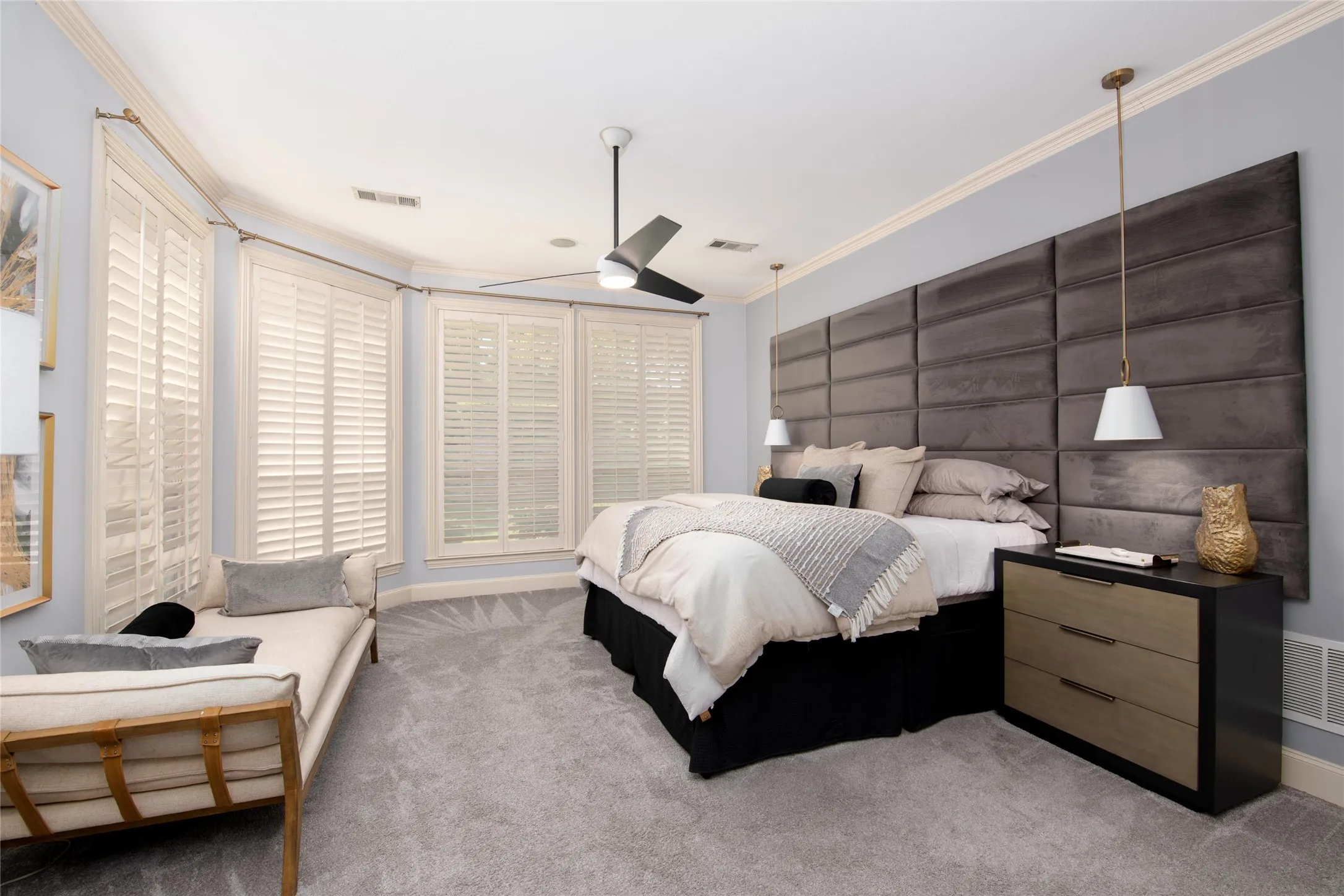The spacious primary retreat is filled with natural light and offers plenty of room for a sitting area in addition to substantial bedroom furnishings.