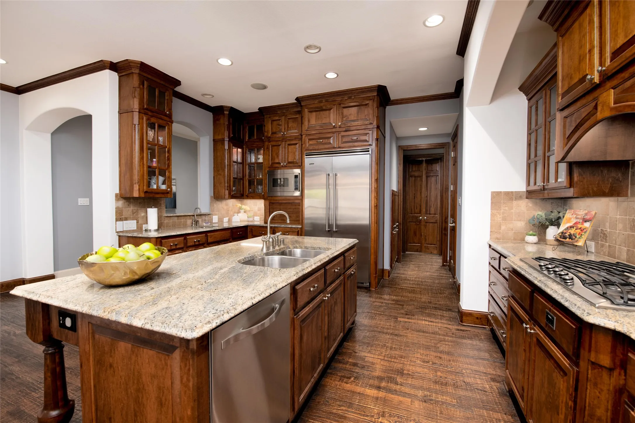 Viking appliances—including the built-in refrigerator—combine professional-level function with the warmth and character of custom cabinetry.