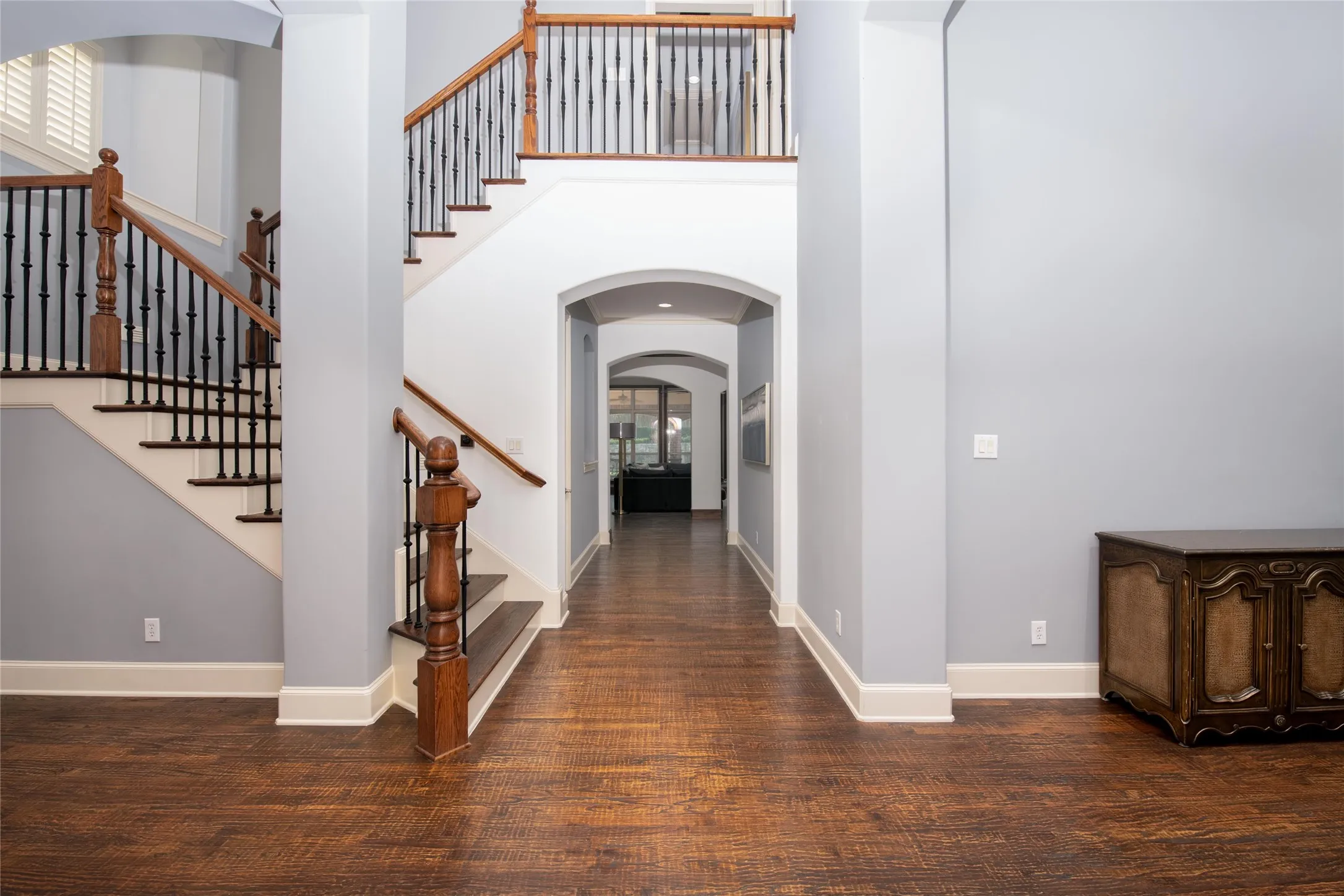 The impressive foyer introduces hand-scraped hardwood flooring, rich wood accents and an open floor plan designed to flow beautifully from room to room.