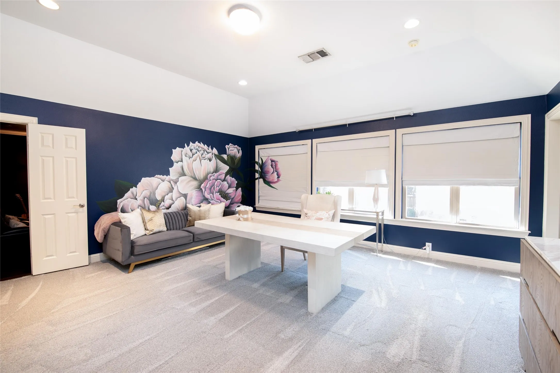 The oversized game room offers incredible flexibility and is currently arranged as a spacious home office, with plenty of room for work, play or entertaining.