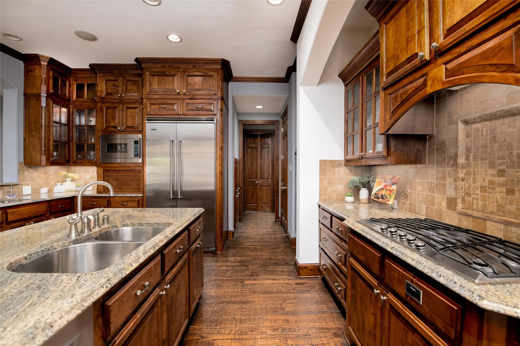 Thoughtfully designed for the serious cook, the kitchen includes double convection ovens, stainless steel appliances and abundant counter space.