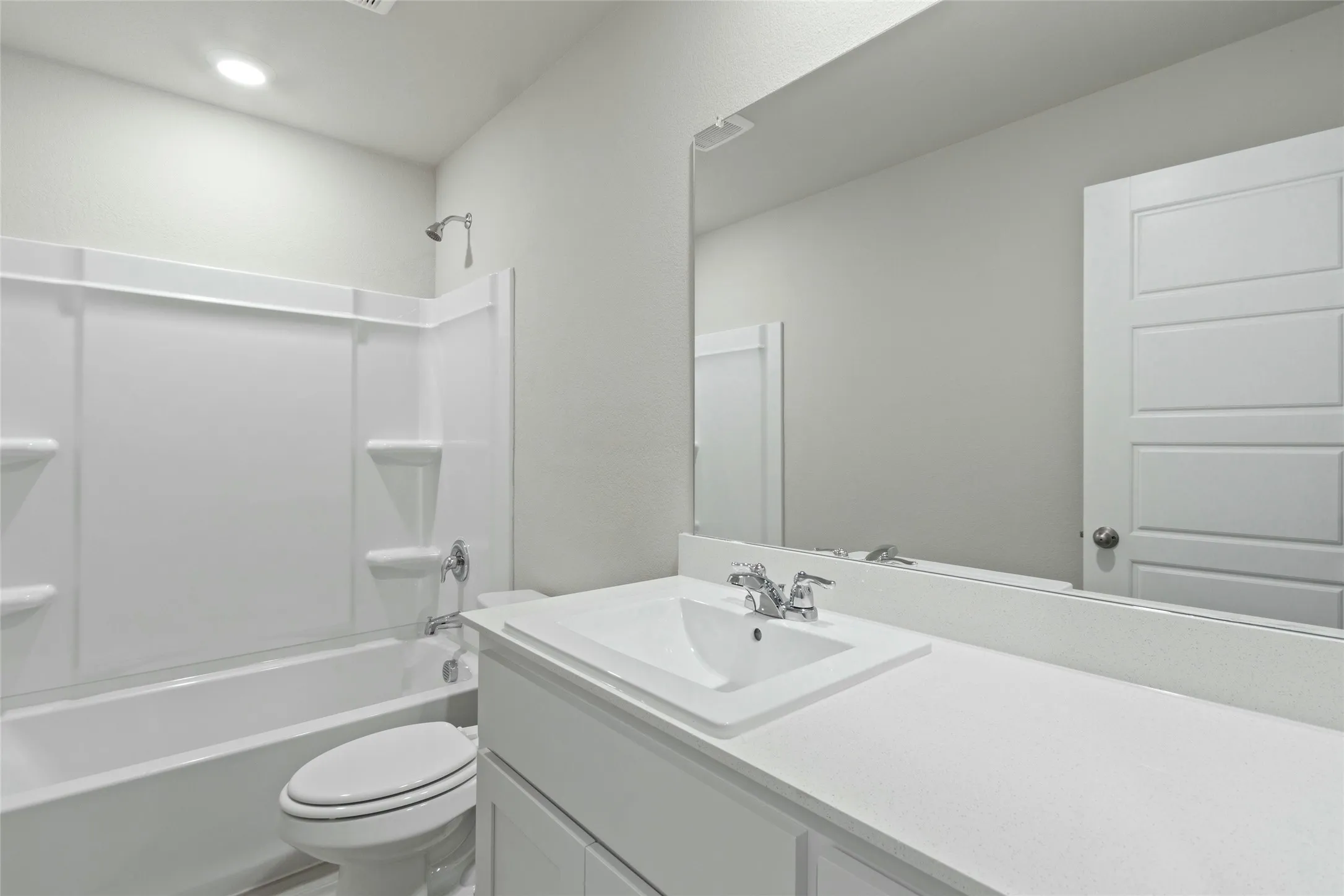 Full bathroom featuring toilet, shower / bath combination, and vanity