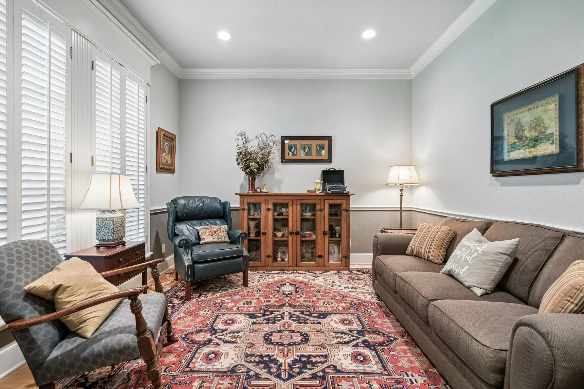 Formal Living Room with crown molding and plantation shutters