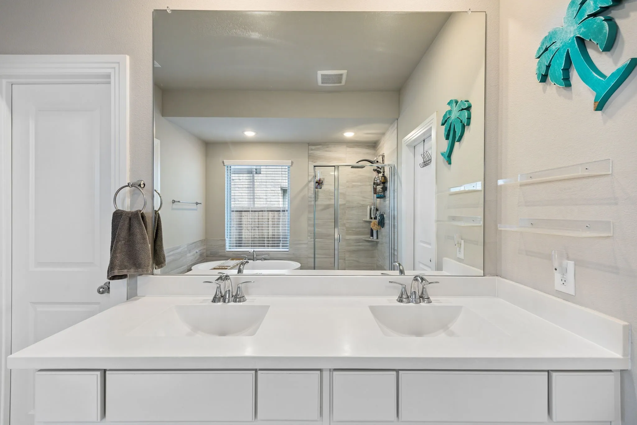 Dual-sink vanity with white quartz countertop and polished chrome faucets