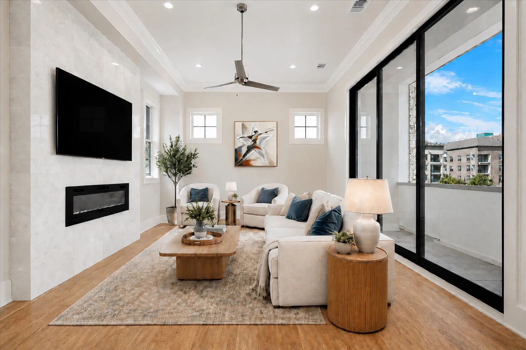 Wood-finish flooring throughout, recessed lighting, and a modern linear fireplace