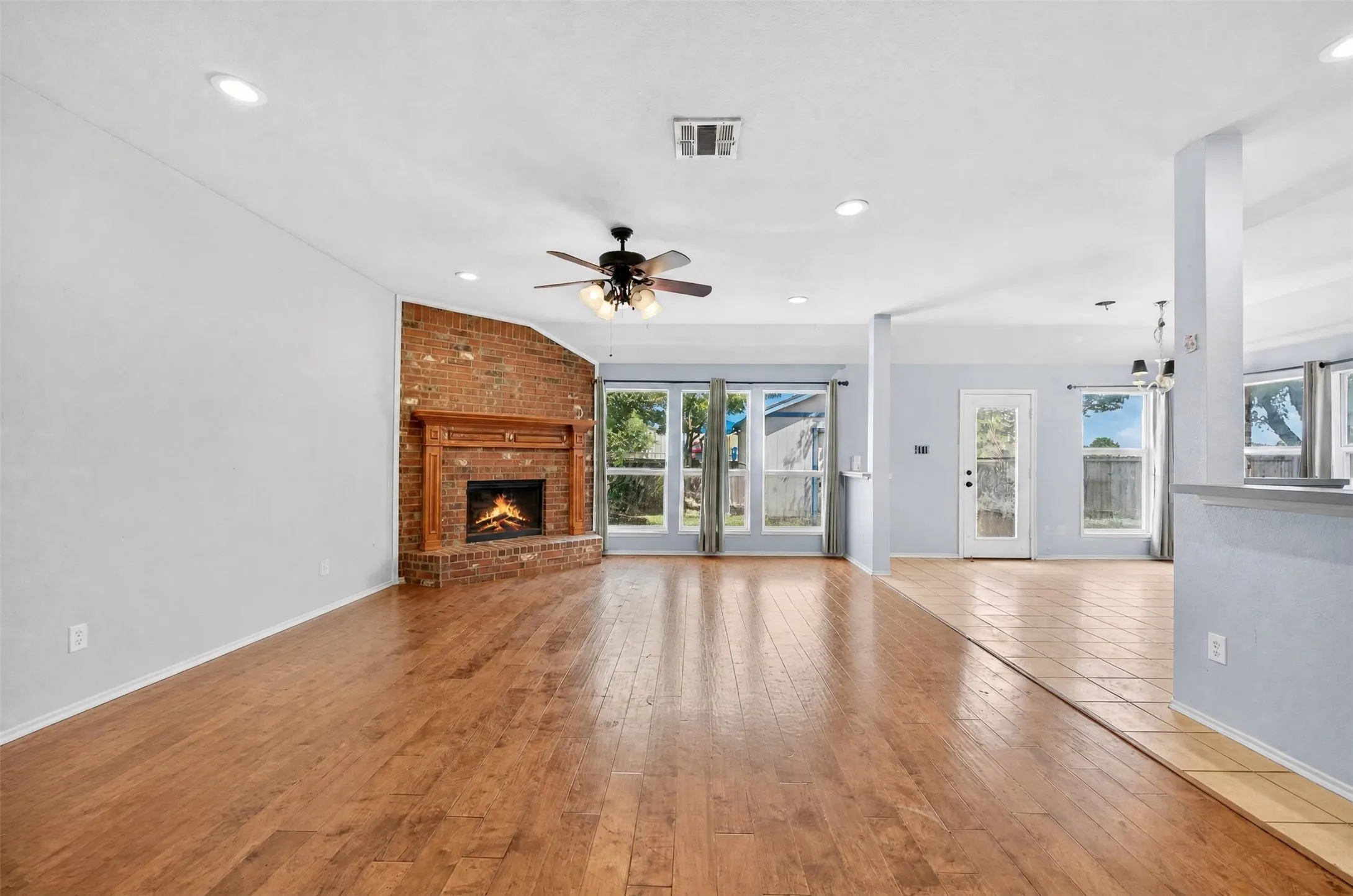 Living room with a corner wood burning fireplace