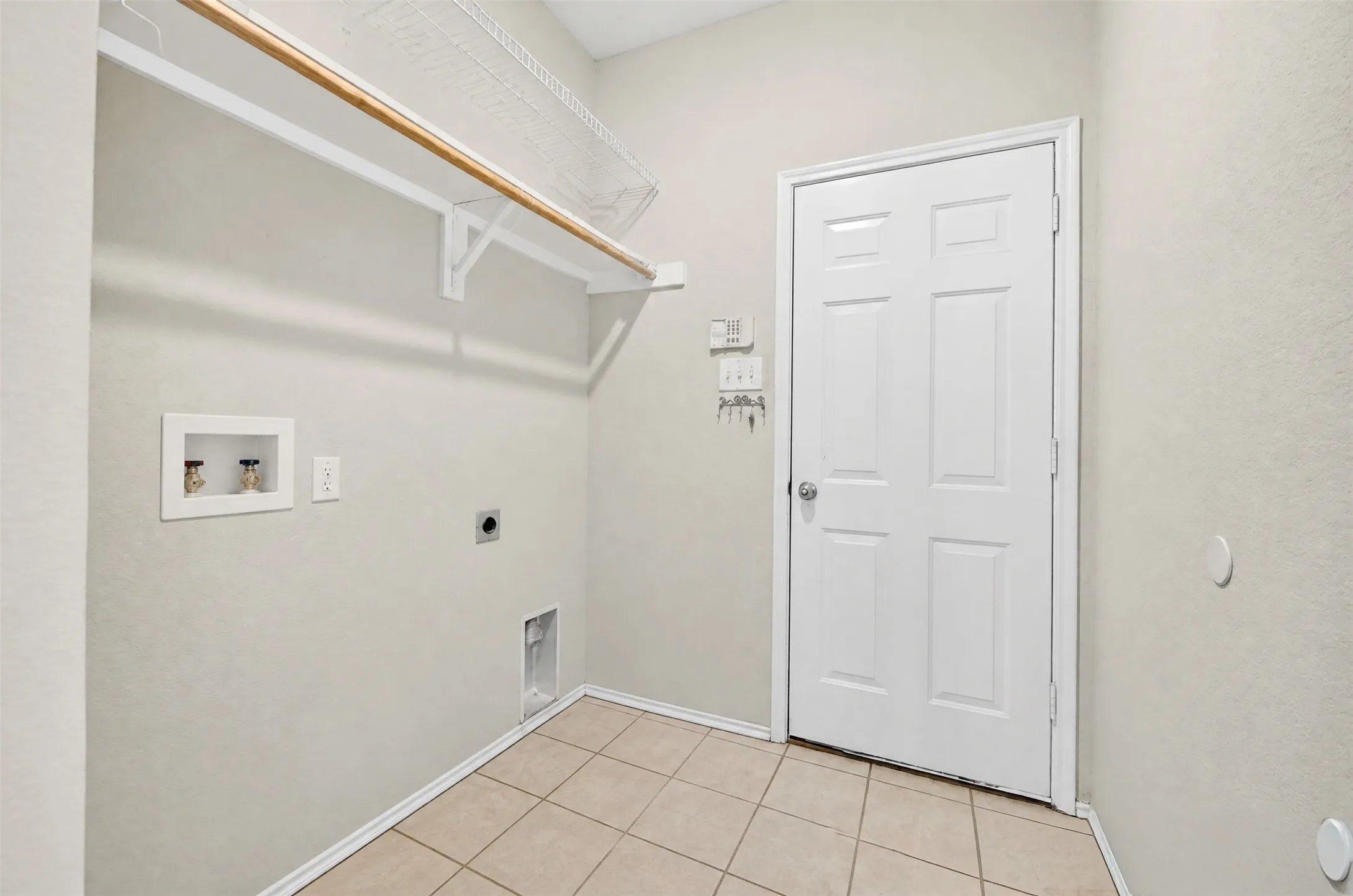 Laundry room and passage way to the garage