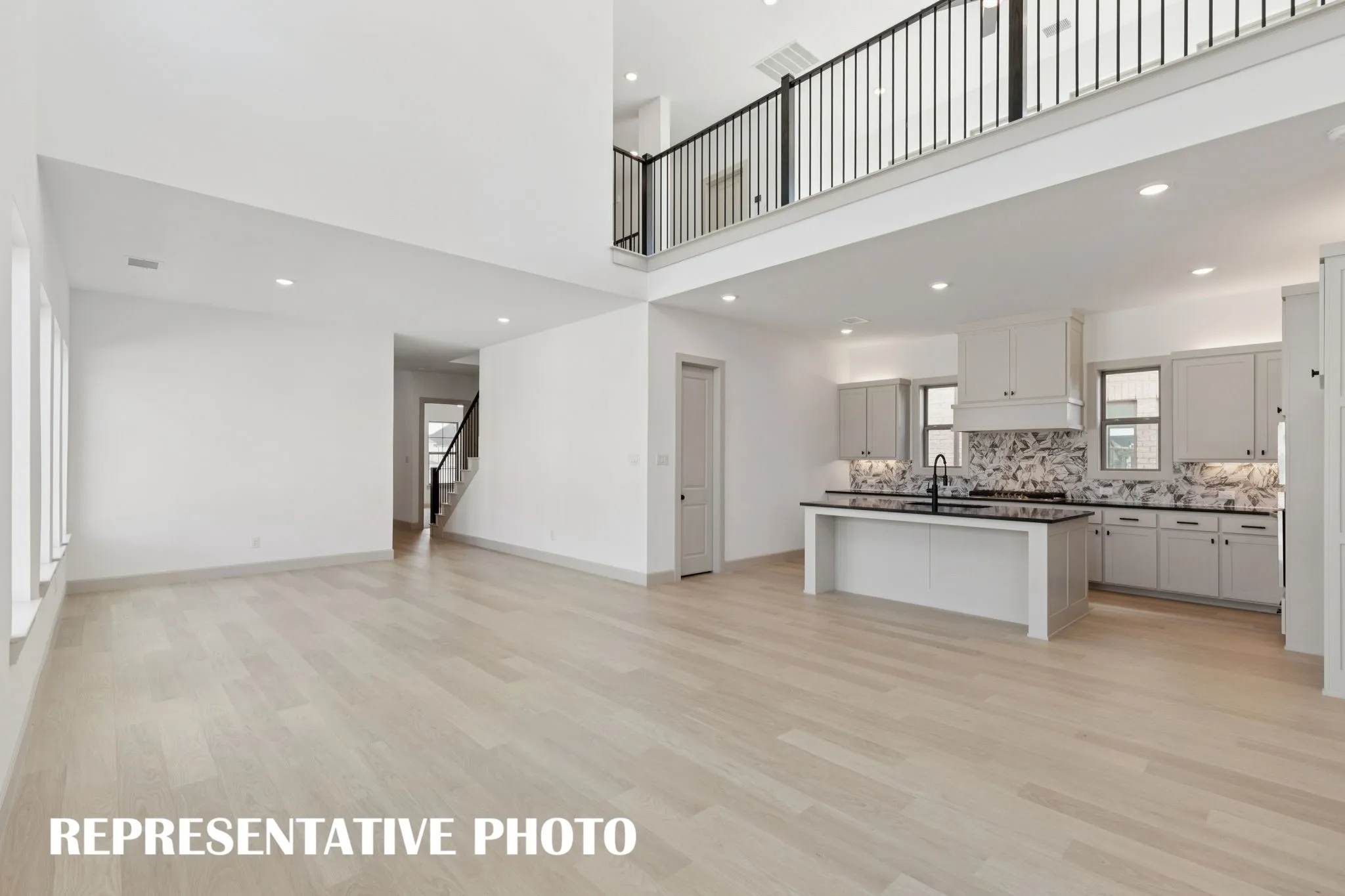 Our Marcel plan offers a home designed for entertaining with the game room open to the family room createing a dual level entertainment zone.  REPRESENTATIVE PHOTO