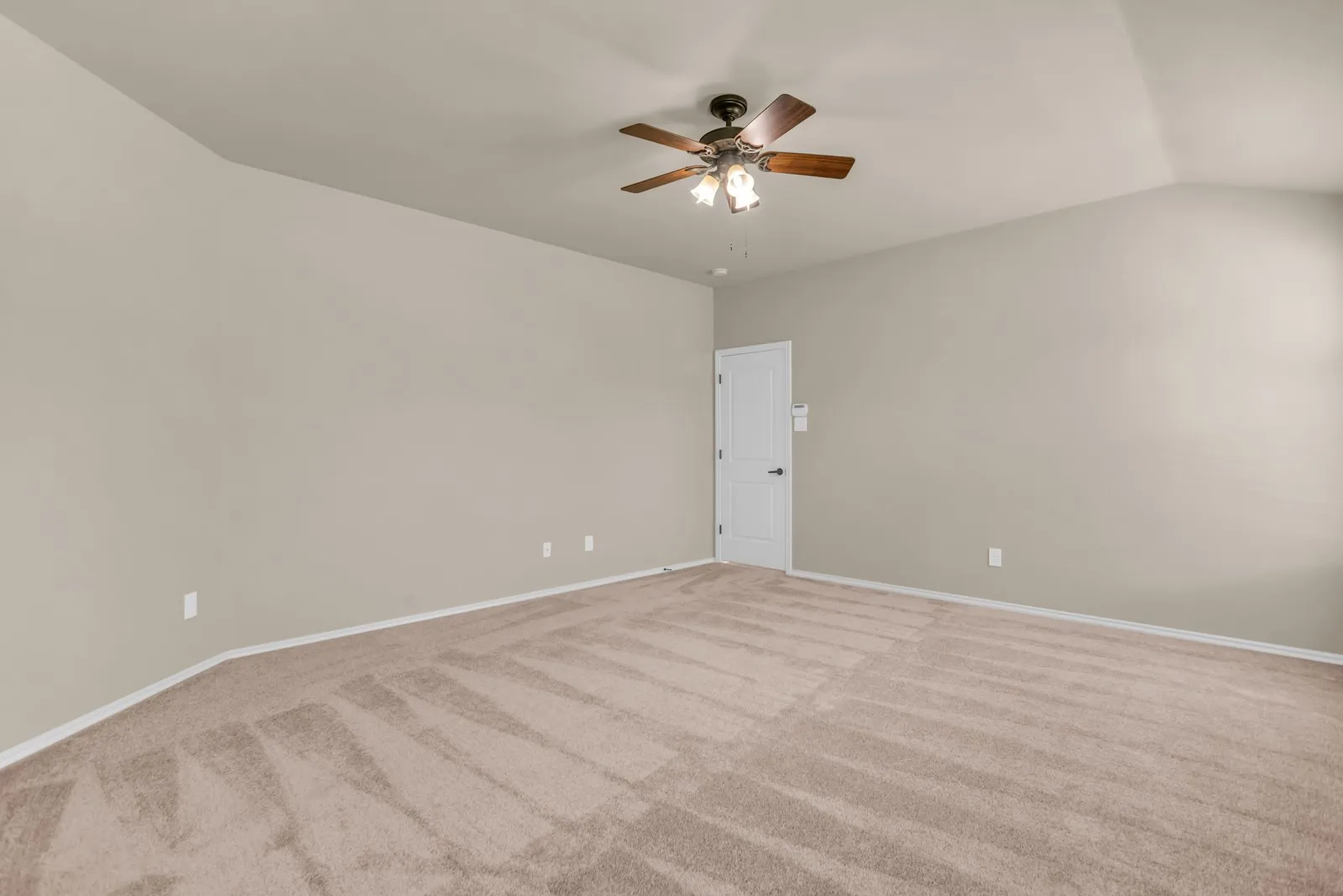 Other view of primary bedroom with brand new carpet.