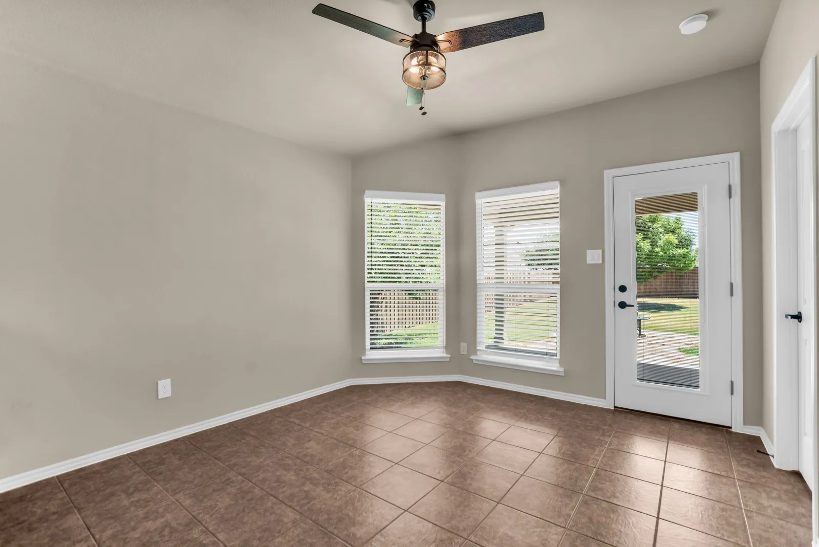 Breakfast area with covered patio in back.