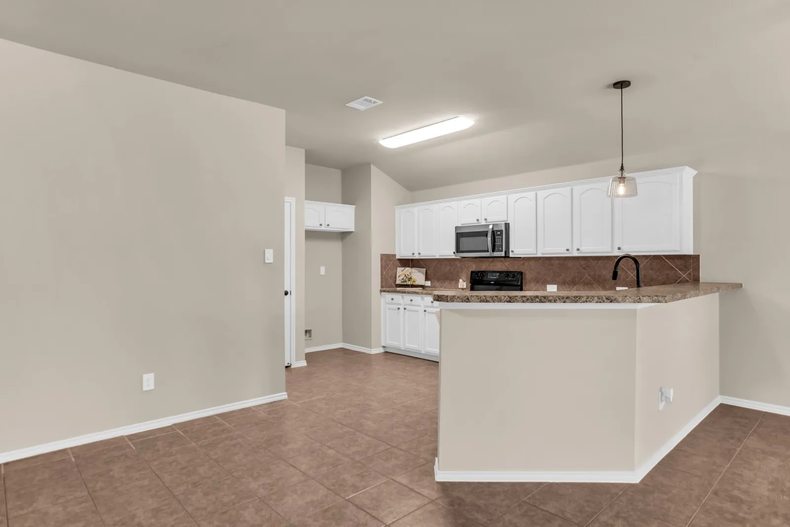 Open living area with kitchen open to living area. Fresh paint throughout.