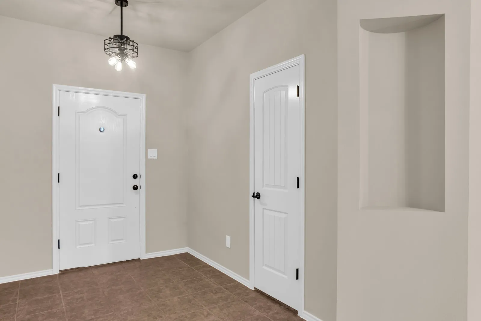 Foyer area with fresh paint and light​​‌​​​​‌​​‌‌​‌‌​​​‌‌​‌​‌​‌​​​‌​​ fixture.