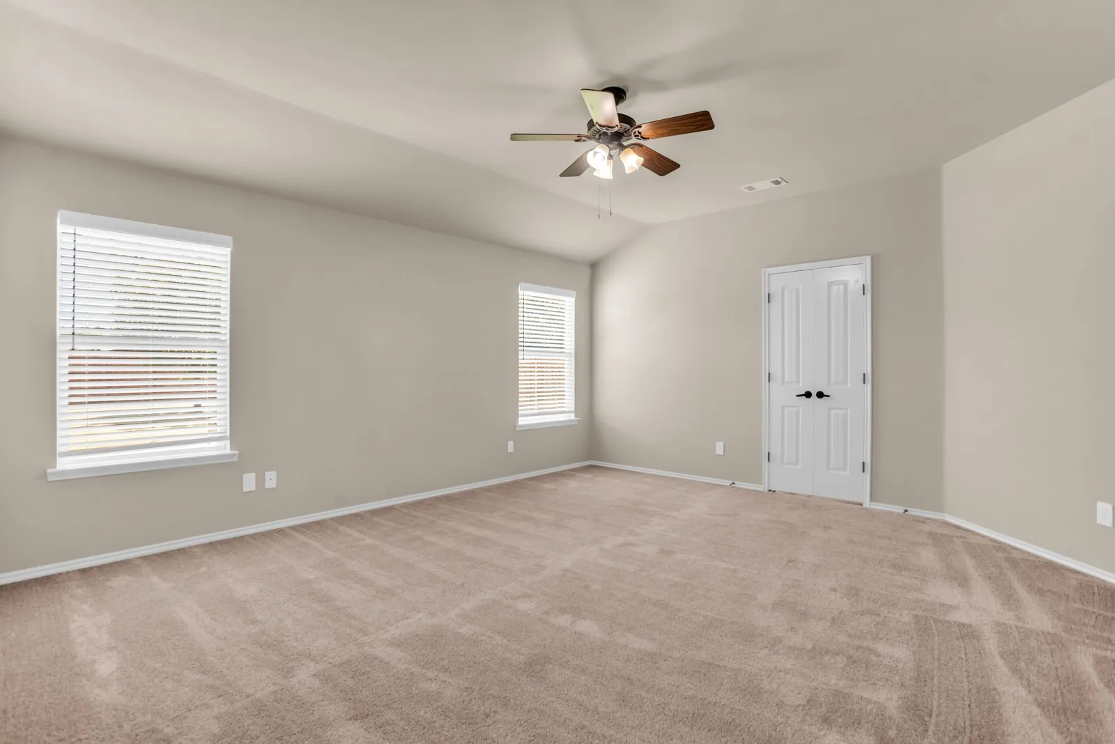Large primary bedroom with new windows and updated ensuite bath.