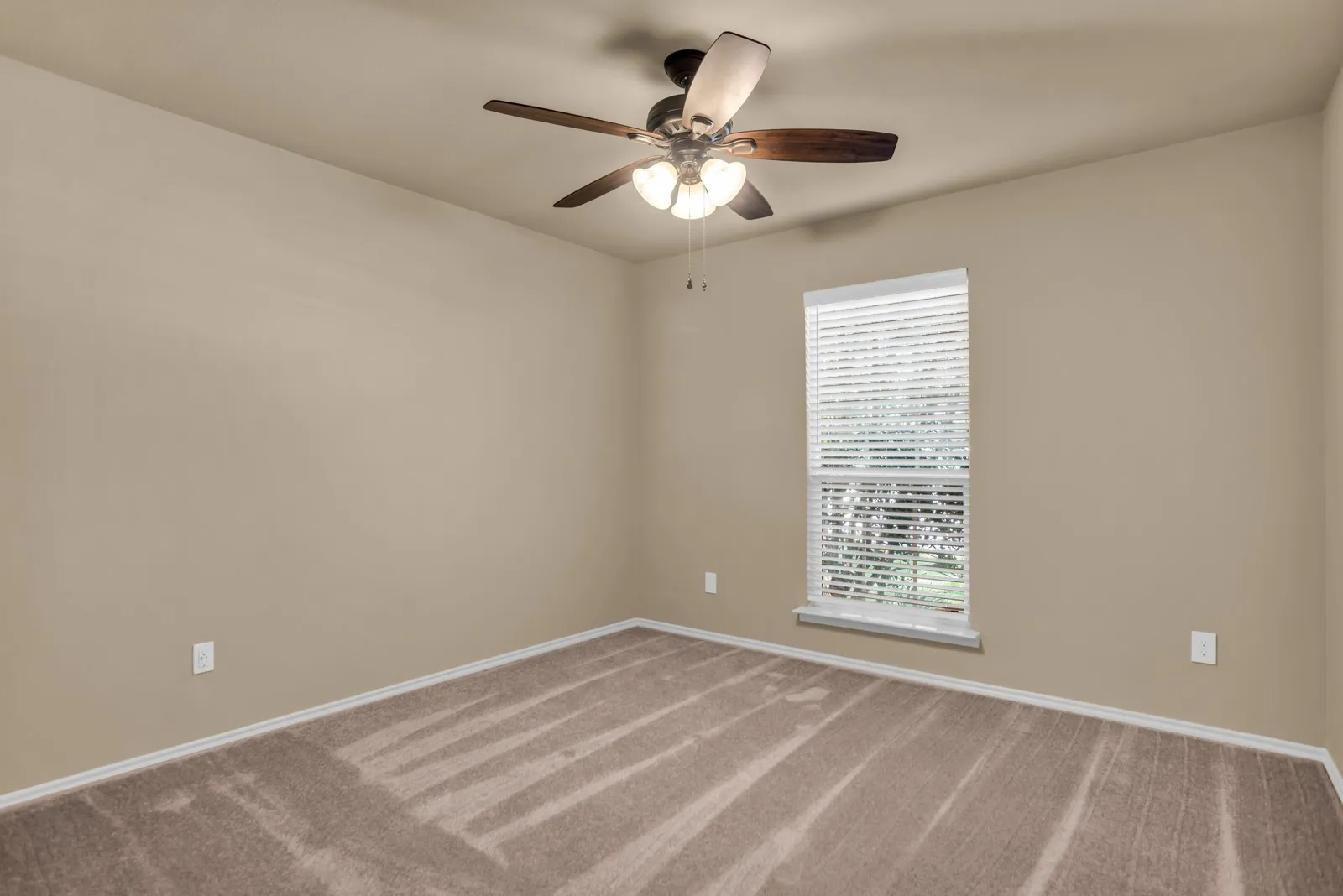 Secondary bedroom with fresh paint and brand new carpet.