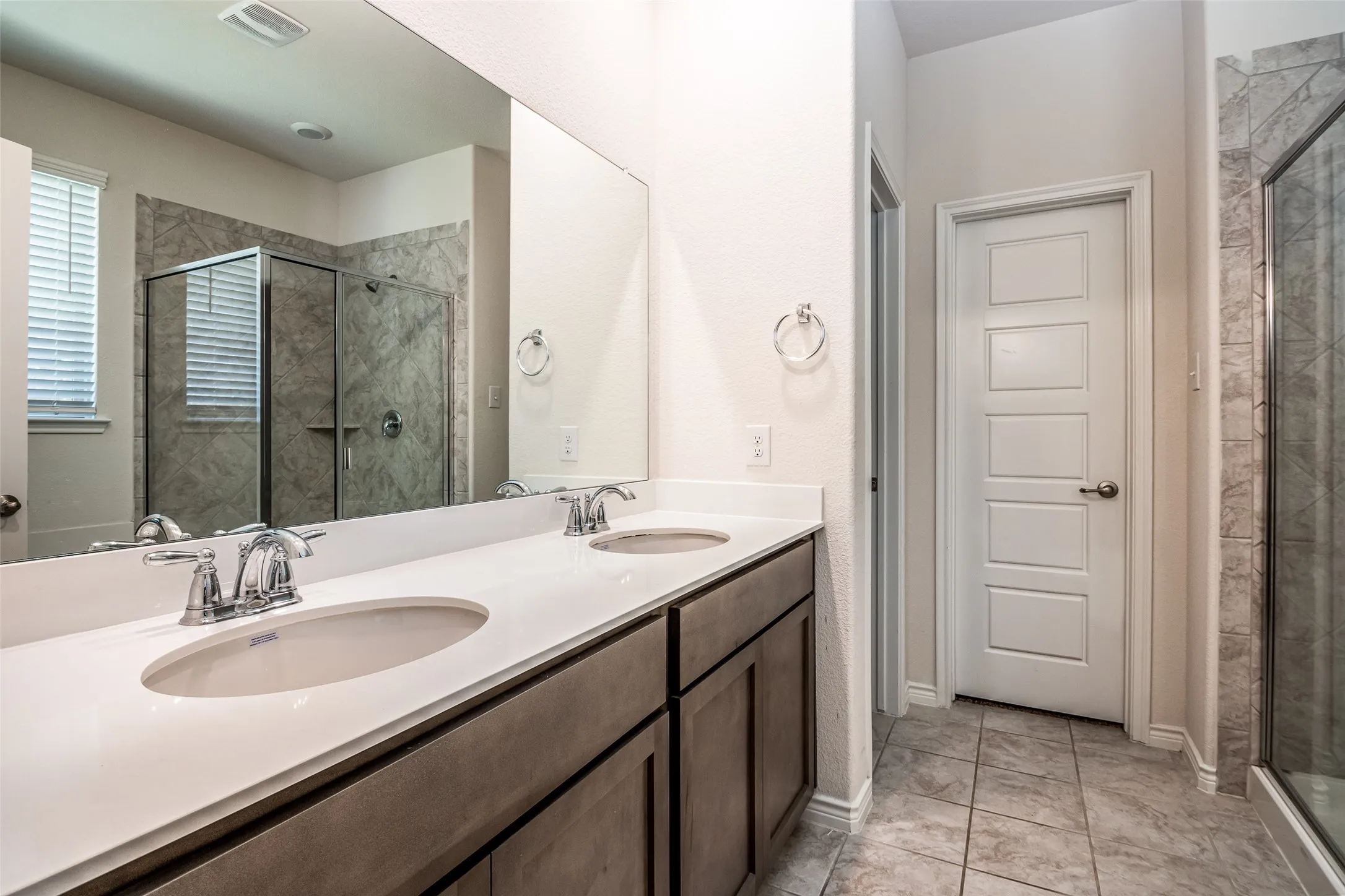 Dual vanity with undermount sinks and chrome fixtures