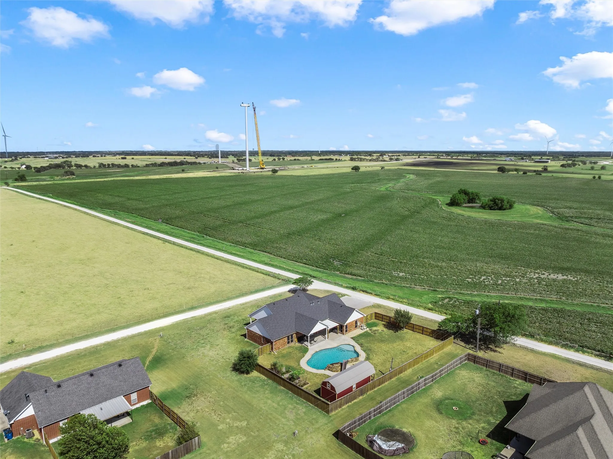 Property with a swimming pool and fenced backyard