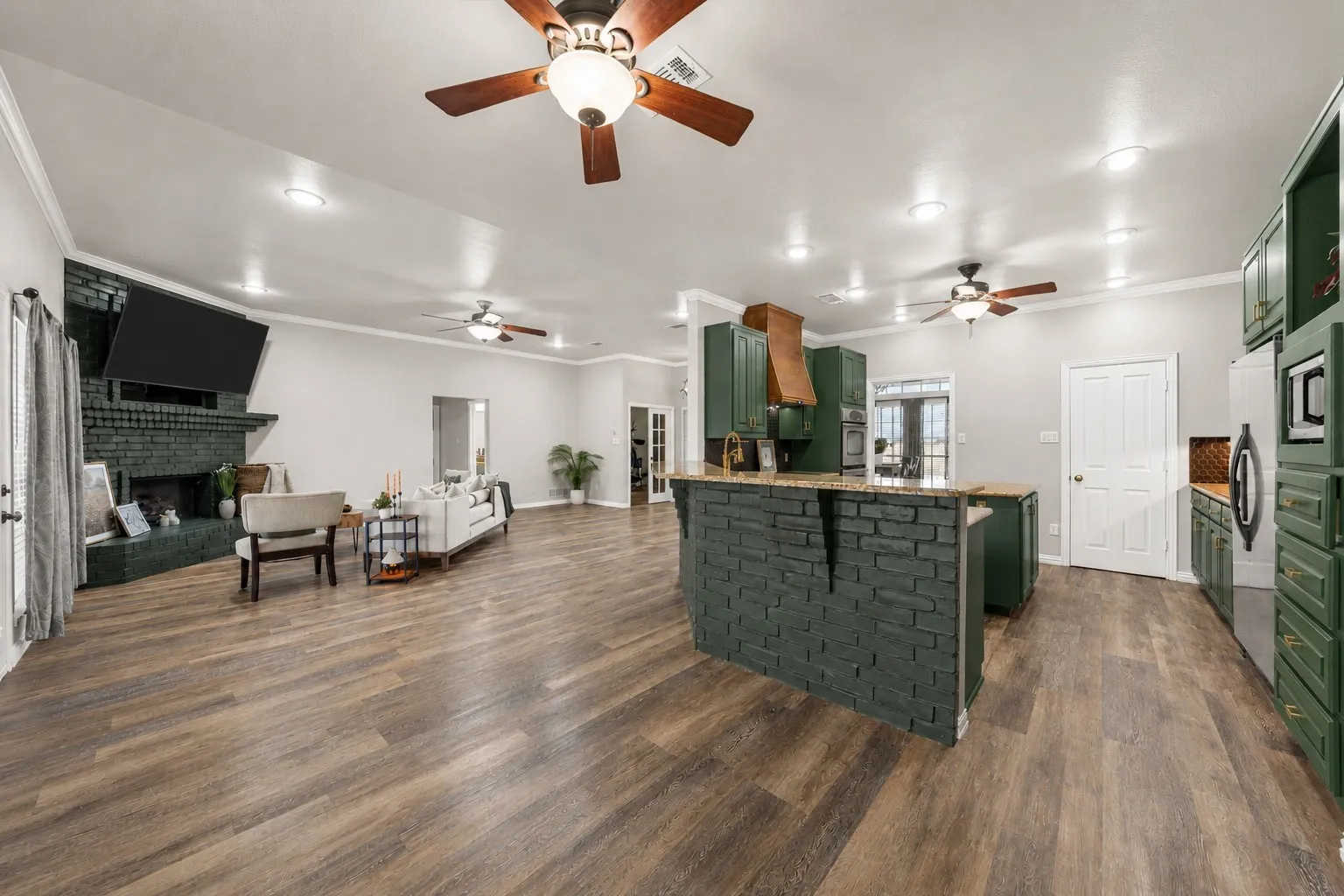 Wood-finish flooring throughout, recessed lighting, and multiple ceiling fans