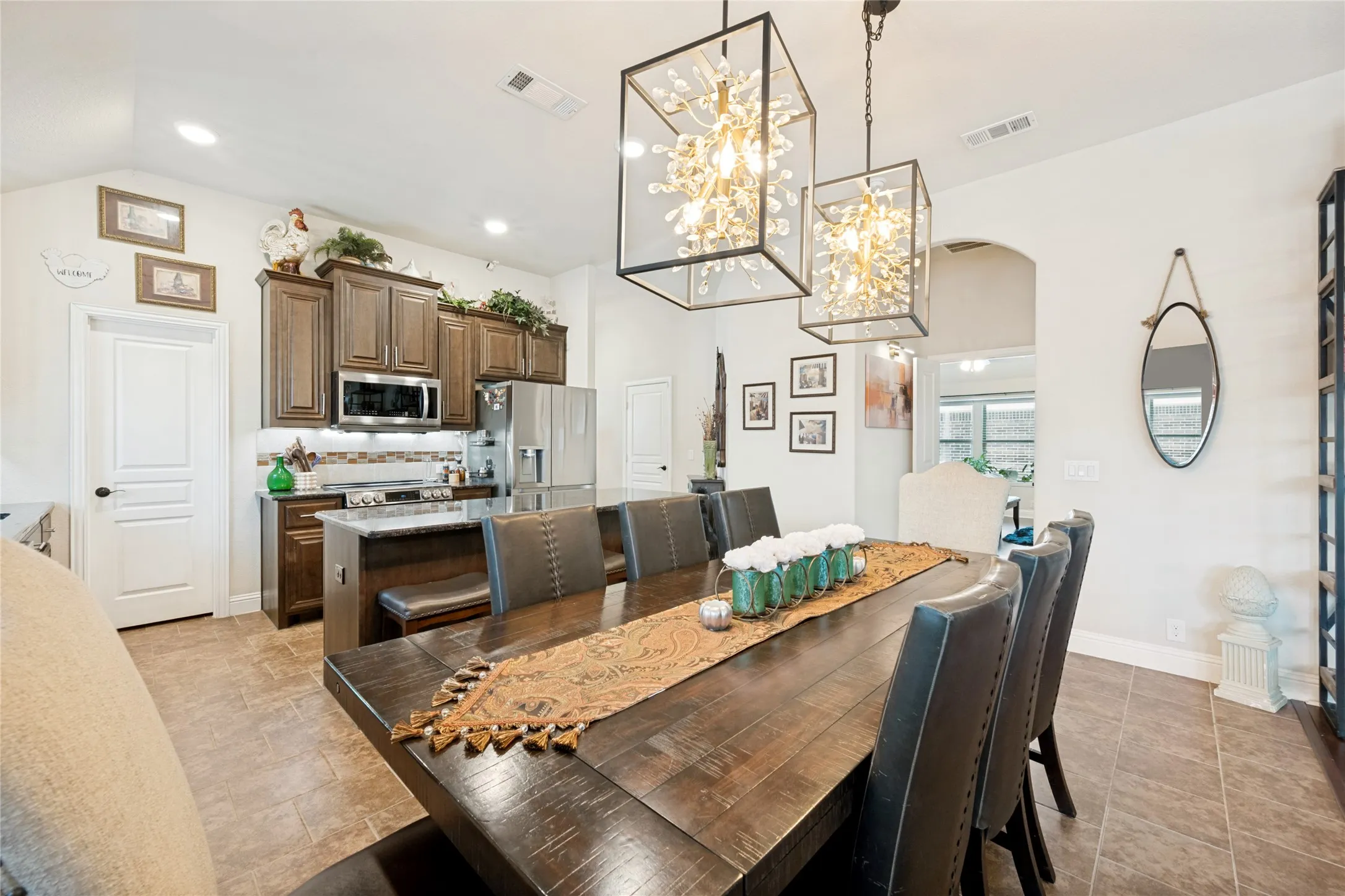 Stunning light fixtures add to the warmth of this open floor plan