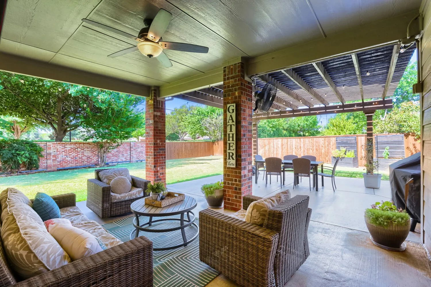 Covered patio with ceiling fan.