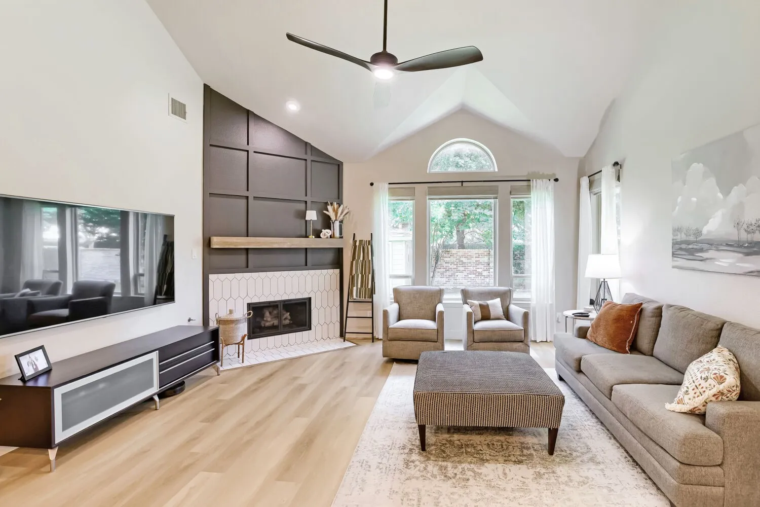 This residence offers an expansive layout complemented by an abundance of natural light.