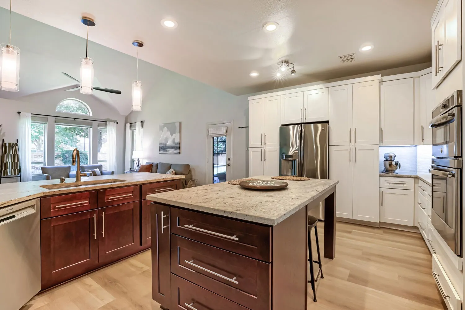Features three granite slabs, a spacious kitchen island, and a large pantry.