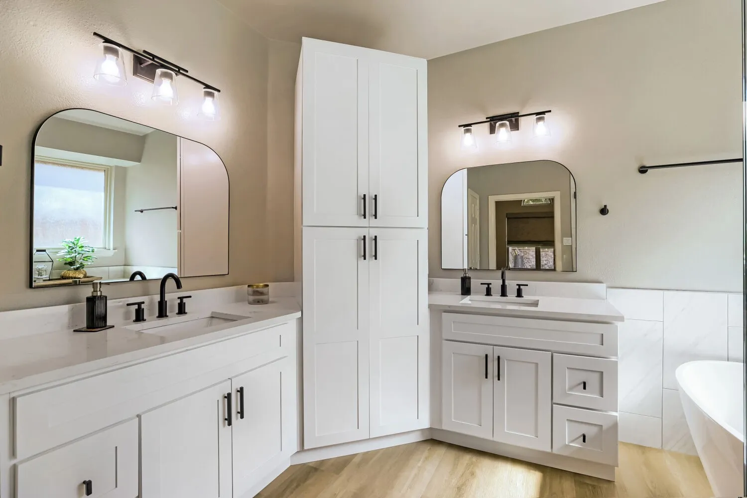 Dual vanities featuring extensive functional storage.