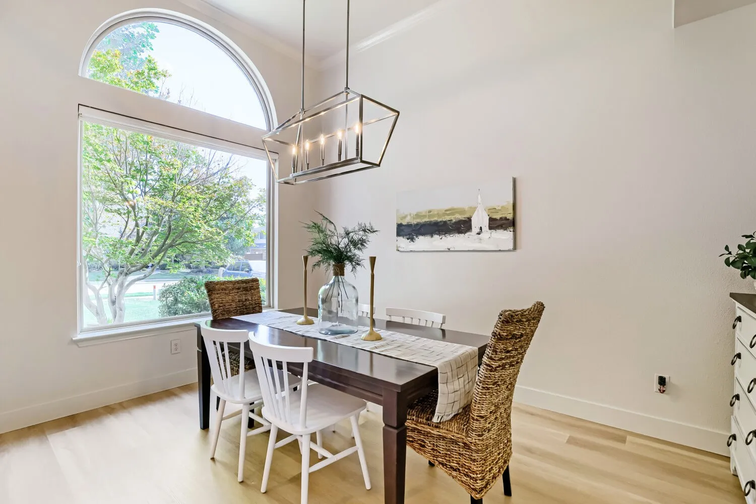 Bright, natural light floods the room through this expansive, picture-framed window.