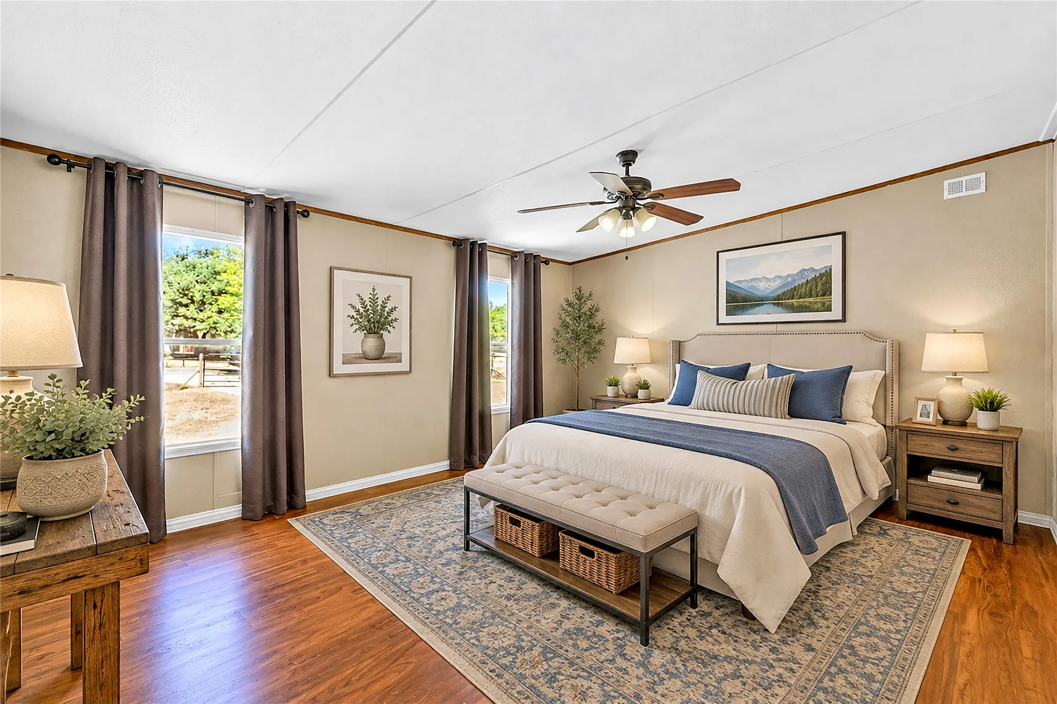 Wood-finish flooring, white ceiling, ceiling fan with light fixture, and multiple windows. Virtually staged photo.