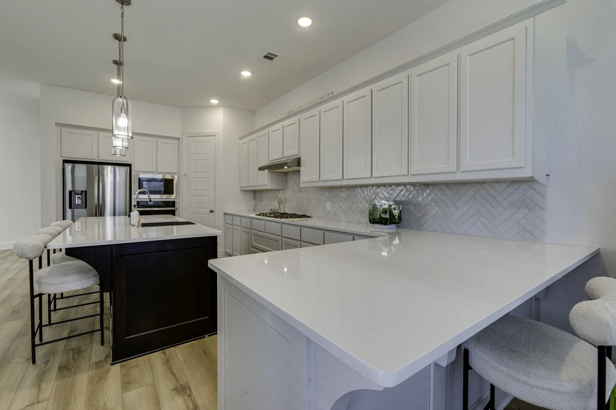 This extra counter space adds room for prepwork, home work and two additional seats.