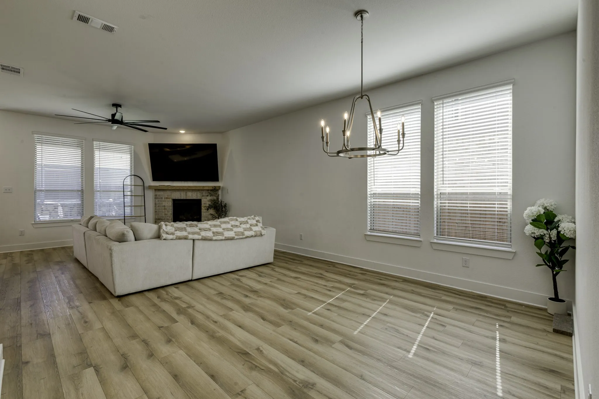 An area off the kitchen that can serve as either one large a living area or separete dining and living.