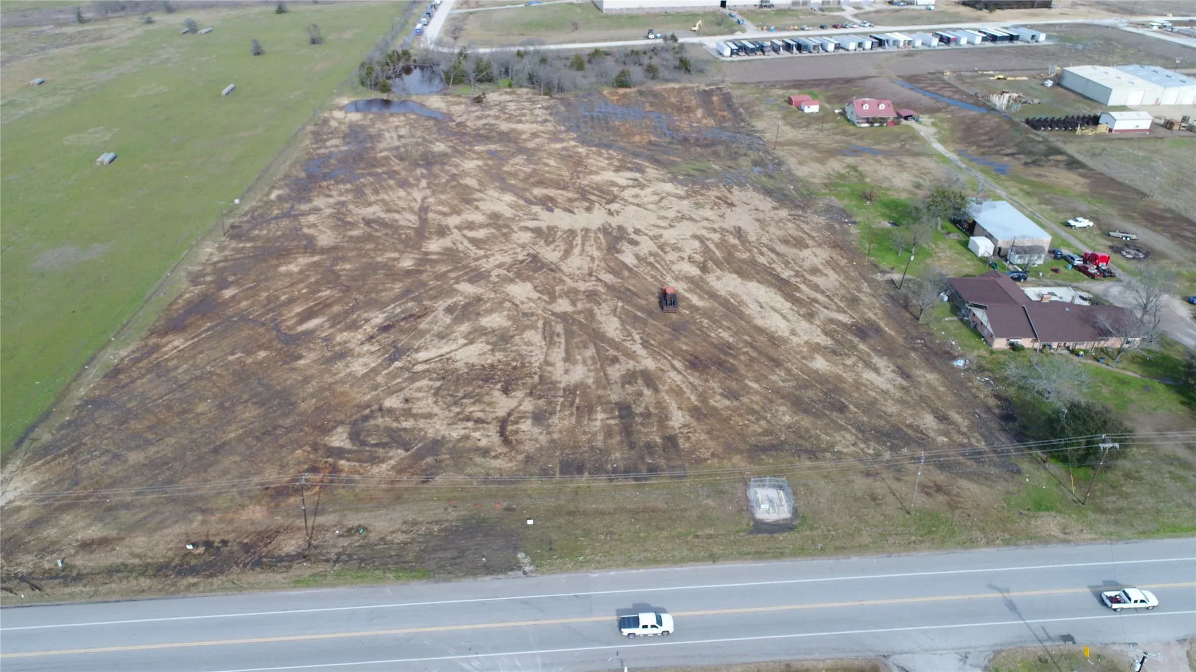 Expansive cleared land parcel with direct road frontage