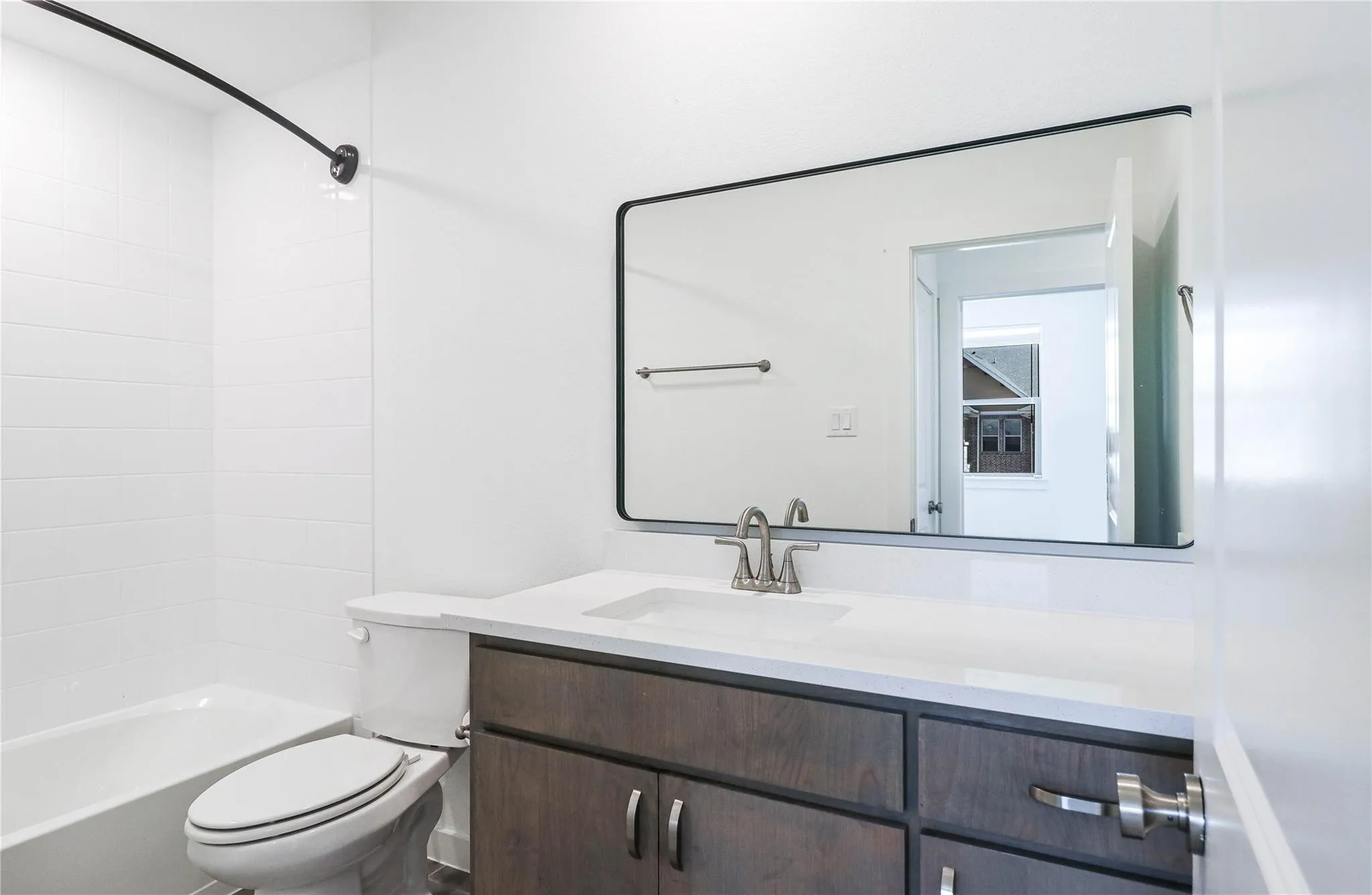 Bathroom featuring vanity and shower / bathtub combination