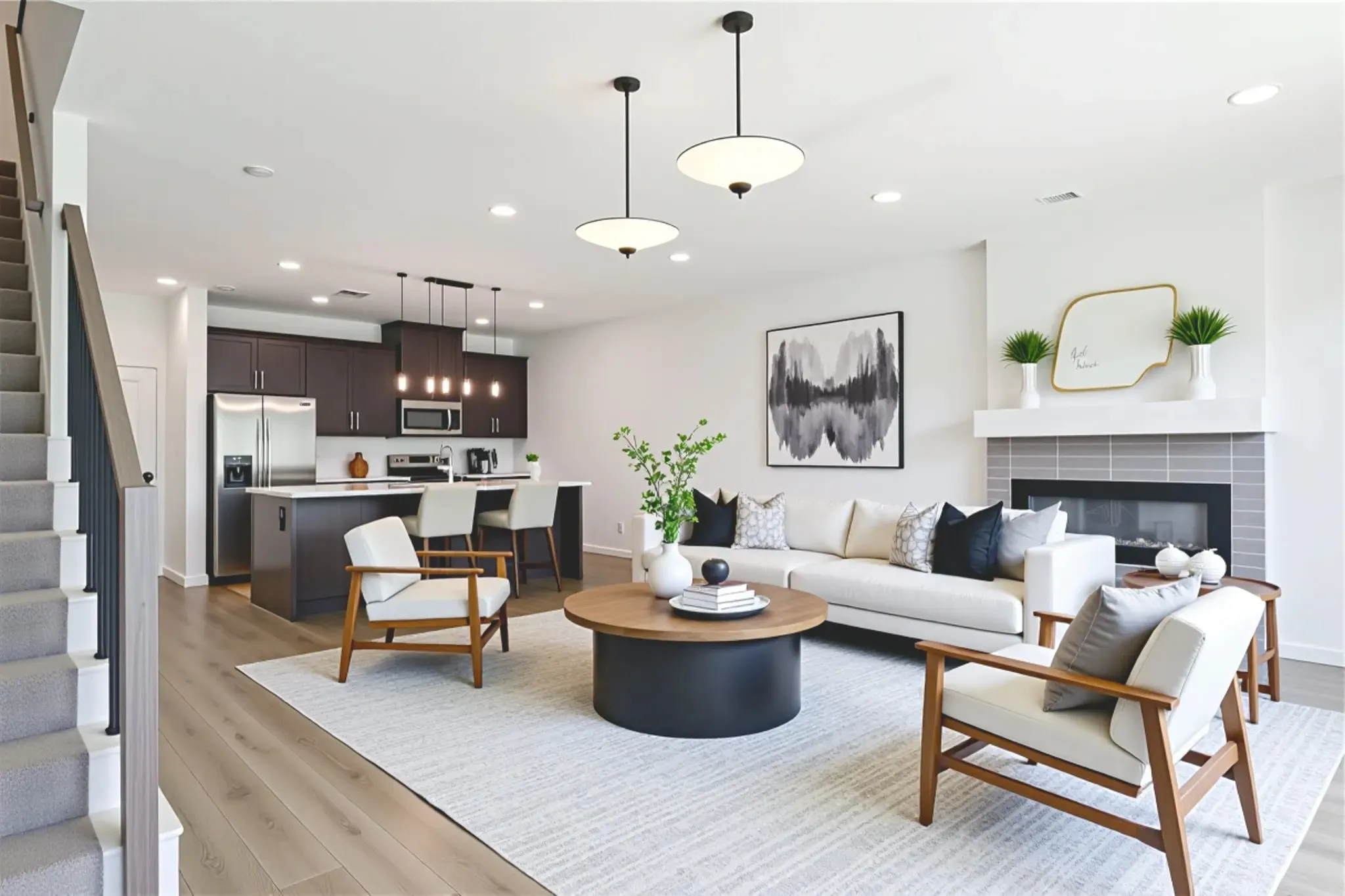 Living room with stairs, recessed lighting, light wood finished floors, and a tiled fireplace