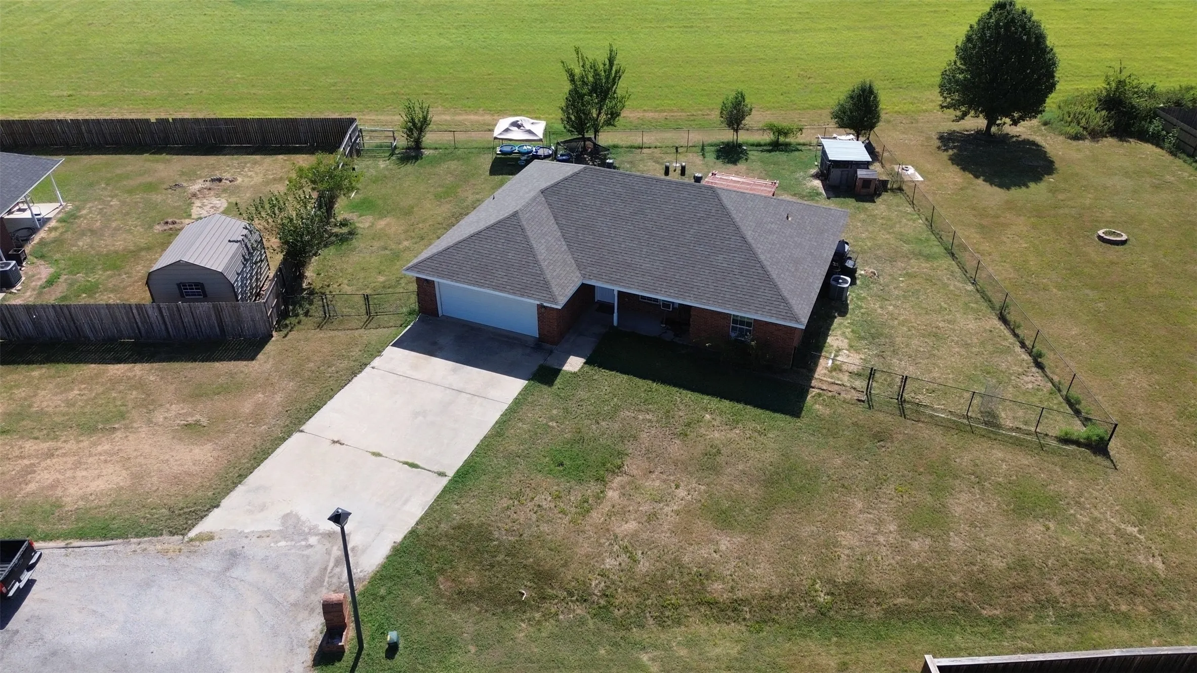 Single-story residence featuring a gray shingle roof and an attached two-car garage