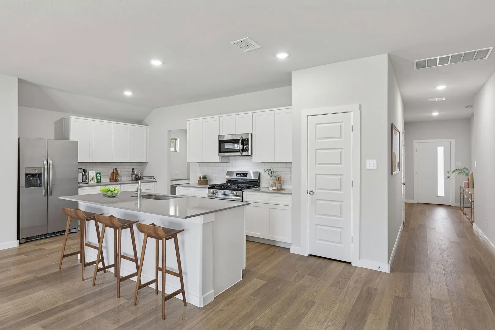 Kitchen in the Harrison home plan by Trophy Signature Homes - REPRESENTATIVE PHOTO