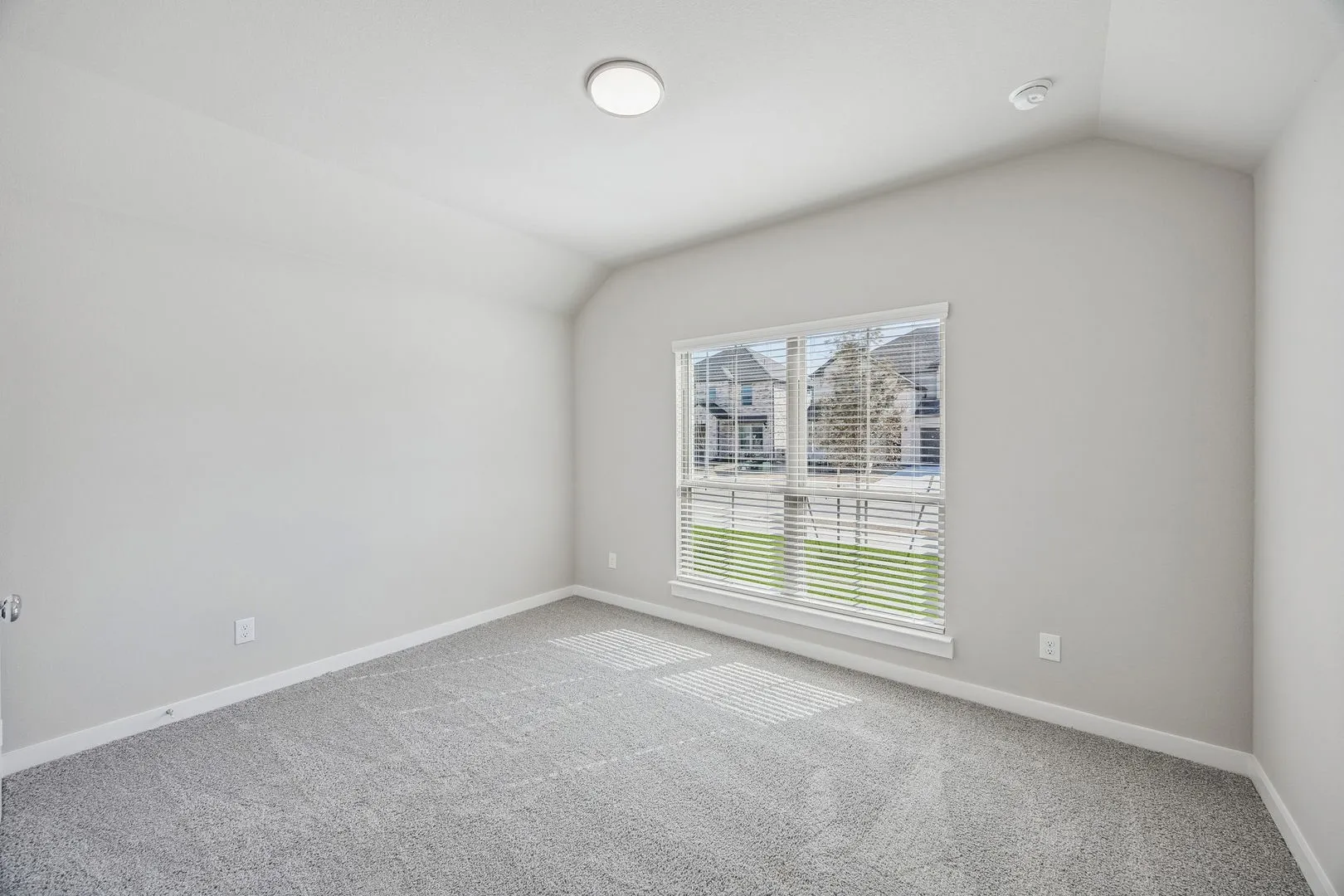 Bedroom in the Heisman home plan by Trophy Signature Homes – REPRESENTATIVE PHOTO
